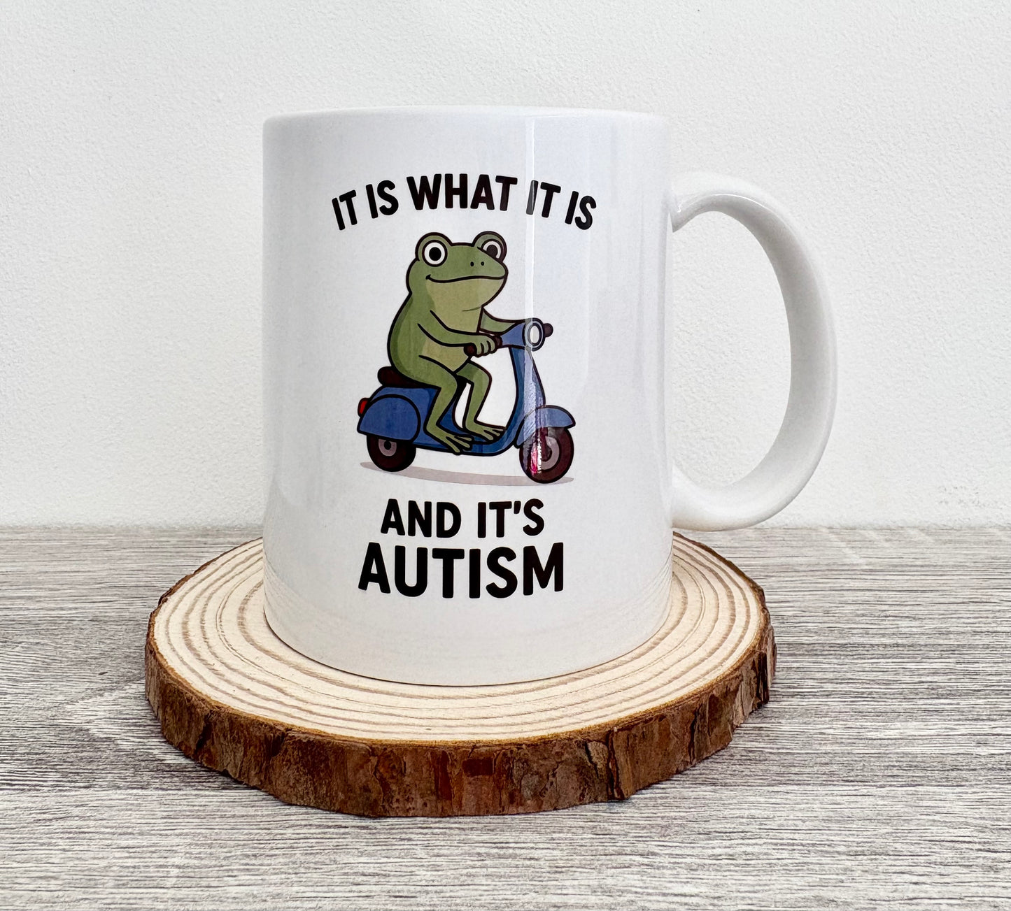 It Is What It Is Autism Mug, Frog on Scooter Coffee Cup, Funny Autism Awareness Gift, Quirky Animal Mug for Him Her, Cute Frog Mug
