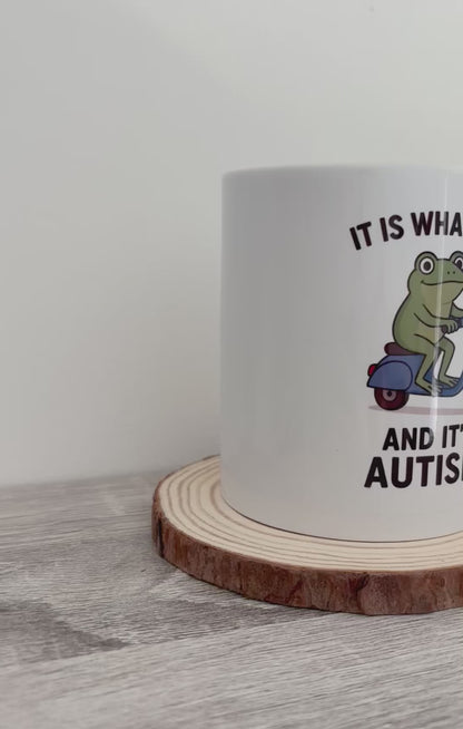 It Is What It Is Autism Mug, Frog on Scooter Coffee Cup, Funny Autism Awareness Gift, Quirky Animal Mug for Him Her, Cute Frog Mug